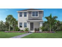 Beautiful two-story home with a landscaped yard, gray siding and stucco exterior at 1438 Ridgeback Ln, Apopka, FL 32703