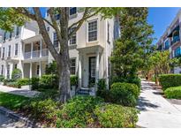 Beautiful townhome facade with lush greenery and a well-manicured lawn at 1521 Chatfield Pl, Orlando, FL 32814