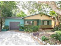 Charming bungalow with a cozy front porch and a well-maintained yard at 1502 E Gore St, Orlando, FL 32806