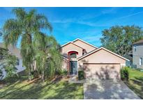 Charming single-Gathering home with a well-manicured lawn and a two-car garage at 16741 Rising Star Dr, Clermont, FL 34714