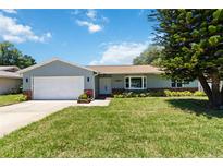 Charming single-story home with well-maintained lawn, brick accents, and lush landscaping at 226 Selkirk Way, Longwood, FL 32779