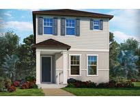 Charming two-story home with a well-manicured lawn and inviting front porch, complemented by colorful landscaping at 14244 Braemar St, Winter Garden, FL 34787