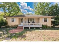 Charming single story home with a welcoming front porch perfect for relaxing and enjoying the outdoors at 2409 Garbelia Ave, Orlando, FL 32817