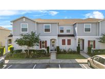 Charming two-story townhome with well-maintained landscaping and a welcoming facade at 281 Primrose Dr, Davenport, FL 33837