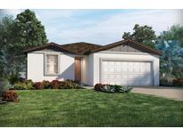 Charming single-story home featuring a well-maintained lawn and an attached two-car garage at 3853 Giorgio Dr, Winter Haven, FL 33884