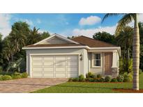 Charming single-story home featuring a garage, landscaped yard, and a welcoming entryway at 3975 Kennebunk Loop, Mount Dora, FL 32757