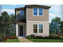 Charming two-story home with a well-manicured lawn and colorful flower beds at 4541 Cross Prairie Pkwy, St Cloud, FL 34772