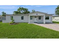 Charming single-story home with fresh green lawn and inviting front porch at 4816 Crow St, Orlando, FL 32819