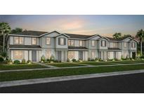 Charming townhome showcases neutral siding, a well-manicured lawn, and lush landscaping enhancing its curb appeal at 10148 Hadley St, Orlando, FL 32829