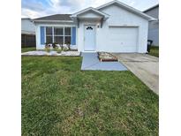 Charming home with a well-manicured front yard and blue shuttered windows at 1025 Clovercrest Rd, Orlando, FL 32811