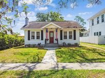 Charming home featuring a landscaped front yard, sidewalk and a quaint exterior at 2505 Amherst Ave, Orlando, FL 32804