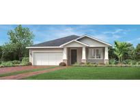 Charming single-story home featuring a two-car garage, welcoming entrance and well-manicured lawn at 2703 Arbor Dune Ave, Apopka, FL 32712
