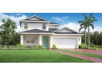 Beautiful two-story home featuring a manicured lawn, two-car garage, and well-maintained landscaping at 2772 Golden Barrel A Ave, Apopka, FL 32712
