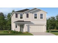 Charming two-story home with a well-manicured lawn and an attached two-car garage at 3507 Kimbrough Dr, Lake Wales, FL 33859