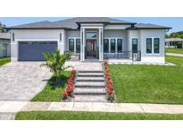 Beautiful home showcasing a landscaped front yard and decorative walkway leading to the front door at 601 Green Briar Blvd, Altamonte Springs, FL 32714