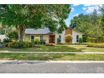 Charming single story home with a manicured lawn, mature trees and inviting curb appeal at 1390 Yellow Pine Ct, Winter Springs, FL 32708