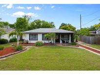 Charming single-story home with a well-manicured front yard and decorative landscaping at 6 S Lakewood Dr, Orlando, FL 32803