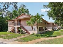 Inviting two-story condo with stairs to the second level and lush lawn at 168 Perimeter Ct # 5C, Deltona, FL 32725