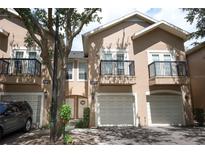 Charming two-story townhome featuring a private balcony and attached garages in a well-maintained community at 2493 Lancien Ct # 5, Orlando, FL 32826