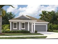Beautiful one-story home featuring a two-car garage, neutral paint and a well-manicured lawn at 5706 Cattle Ranch Drive, St Cloud, FL 34771