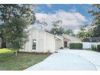 Charming single-story home featuring a well-manicured lawn and inviting curb appeal at 708 Wilson Rd, Winter Springs, FL 32708