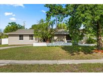 Charming single-story home with well-maintained landscaping and a lovely front yard, offering great curb appeal at 110 S Edgemon Ave, Winter Springs, FL 32708