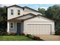 Charming two-story home with a grey door, manicured lawn, and a two car garage at 1119 Cumberland Trail Dr, Lake Hamilton, FL 33851