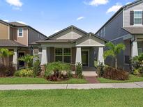 Charming single-story home featuring manicured landscaping, covered entry, and a well-maintained front yard at 12009 Walmsley Aly, Winter Garden, FL 34787