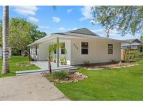Charming single-story home with well-manicured lawn and inviting curb appeal at 215 Bradbury Ave, Oak Hill, FL 32759