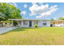 Charming single-story home featuring a well-maintained lawn and a covered carport with space for parking at 4267 Kirkland Blvd, Orlando, FL 32811