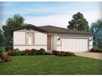 Charming single-story home featuring a well-manicured lawn and a two-car garage at 4537 Windy Oak Way, St Cloud, FL 34772
