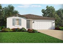 Charming single-story home showcasing a well-manicured lawn and a neutral color palette at 4543 Windy Oak Way, St Cloud, FL 34772