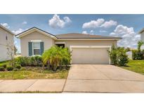 Charming single-story home featuring a two-car garage and well-maintained landscaping at 600 Buchannan Dr, Davenport, FL 33837