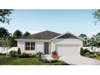 Charming single-story home featuring a well-manicured lawn and a convenient attached garage at 730 Ginger Dr, Haines City, FL 33844