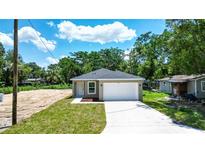 Charming single-story home with a well-maintained lawn and attached one car garage at 2260 Suanne Ave, Eustis, FL 32726