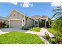 Charming single-story home featuring a well-manicured lawn and inviting front entrance at 2941 Marlberry Ln, Clermont, FL 34714