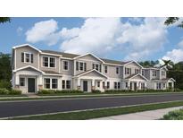Charming townhome showcases a two-story design with neutral siding, dark shutters, and inviting covered front porches at 7342 Ivy Tendril Ave, Orlando, FL 32829
