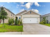 Charming single-story home featuring a two-car garage and well-maintained landscaping with a classic design at 1267 Berry Ln, Davenport, FL 33837