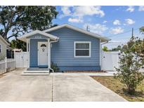 Charming blue single-story home featuring a well-manicured yard and a inviting front entrance at 1432 Selma Ave, Orlando, FL 32825