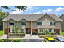 Charming townhome featuring well-maintained landscaping, inviting curb appeal, and convenient parking at 184 Sandlewood Trl # 2, Winter Park, FL 32789