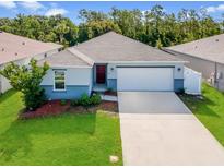 Charming single-story home with well-manicured lawn and attached two-car garage in a well-maintained community at 2835 Mosshire Cir, St Cloud, FL 34772