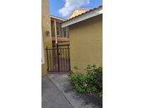 Exterior image of courtyard with brick pavers and black iron gate for added privacy at 706 Lighthouse Ct, Altamonte Springs, FL 32714
