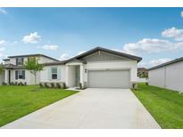 Charming single-story home with a well-manicured lawn and a two-car garage, offering a welcoming curb appeal at 2089 Rosewood Dr, Bartow, FL 33830