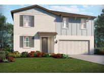 Charming two-story home featuring a two-car garage and beautifully landscaped front yard at 2122 Rosewood Dr, Bartow, FL 33830