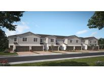Charming townhomes feature attached garages, manicured landscaping, and a welcoming neighborhood appeal at 2521 Starry Pt, St Cloud, FL 34769