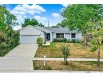 Charming single-story home with a well-maintained front yard and attached garage, perfect for Gathering living at 840 Baybreeze Ln, Altamonte Springs, FL 32714