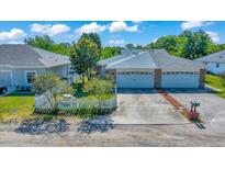 Charming home featuring a well-maintained yard, inviting curb appeal, and a spacious two-car garage at 1115 S Mary St, Eustis, FL 32726