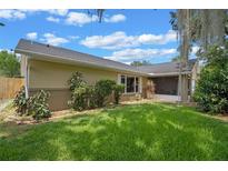 A spacious backyard with a well-maintained lawn and mature landscaping, perfect for outdoor enjoyment at 3362 Partridge St, Deltona, FL 32738