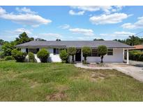 Charming single-story home with a well-maintained lawn and inviting front entrance at 1216 Floral Way, Apopka, FL 32703