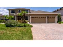 Beautiful two story home with a well manicured lawn and a three car garage at 1716 Wild Indigo Ter, Oviedo, FL 32766